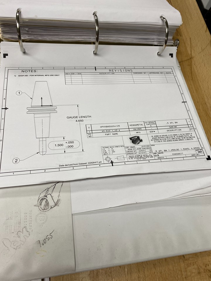 Three-ring binder with tool assembly drawing